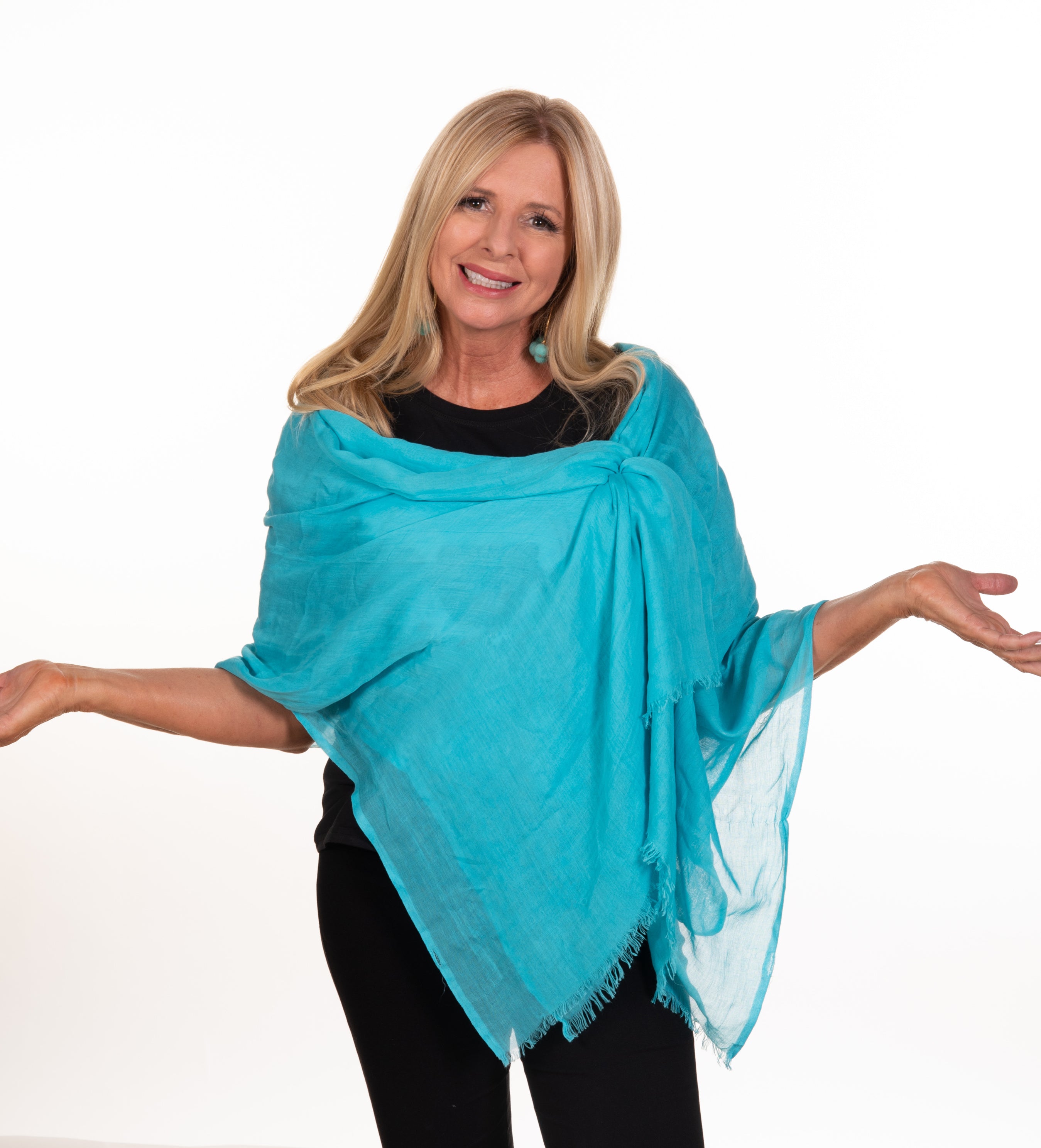 Sofia - The Cinch It!  wearing a blue scarf perfectly styled with Cinch It!